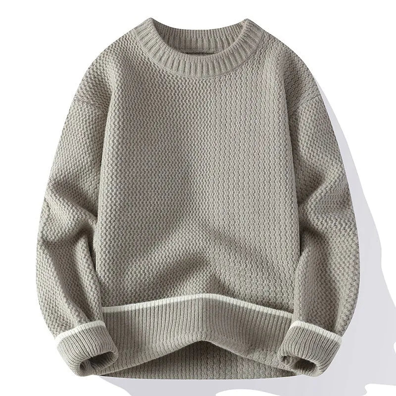 Men's loose fit knit sweater in polyester blend fabric showing round neck and long sleeve design