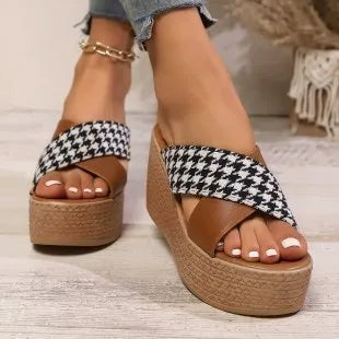 Brown and black cross leopard plaid pattern wedge sandals with a rubber sole.