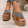 Brown and black cross leopard plaid pattern wedge sandals with a rubber sole.