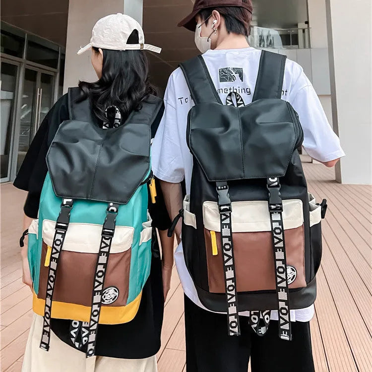 Oxford cloth backpack in black, green, or red, showing handheld and shoulder straps