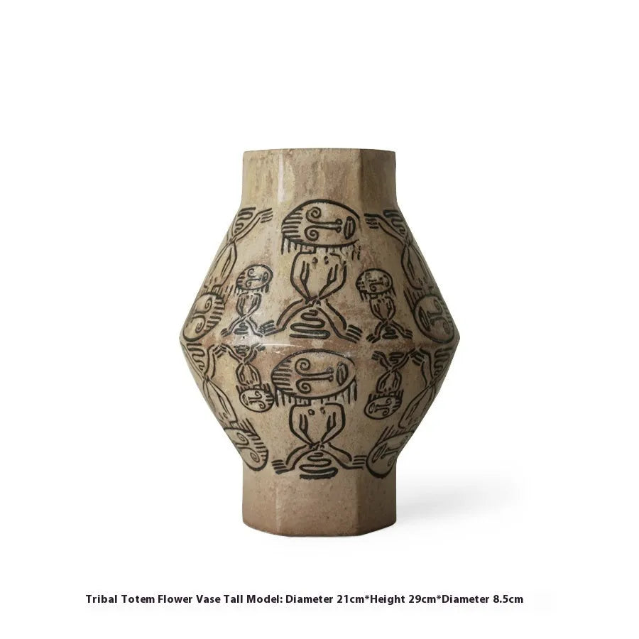 Hand-painted ceramic vase with vintage carved religious patterns in cylindrical shape