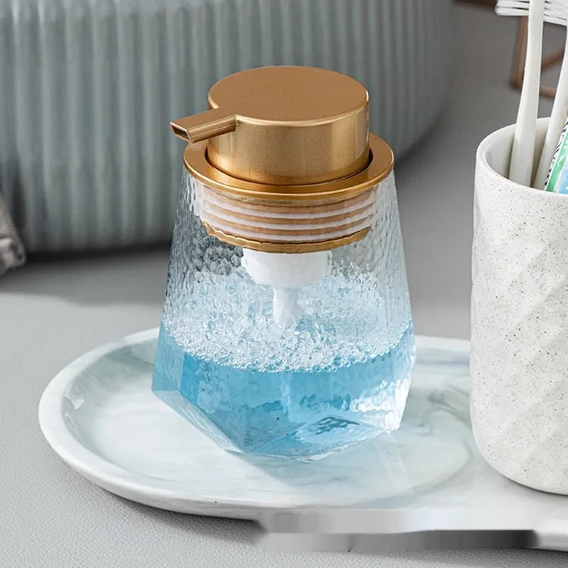 Facial cleanser foam pump with large plastic head in various metallic finish options.