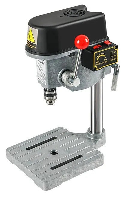 Mini bench drill and milling machine on a workbench with cross bench pliers and heavy-duty pliers.