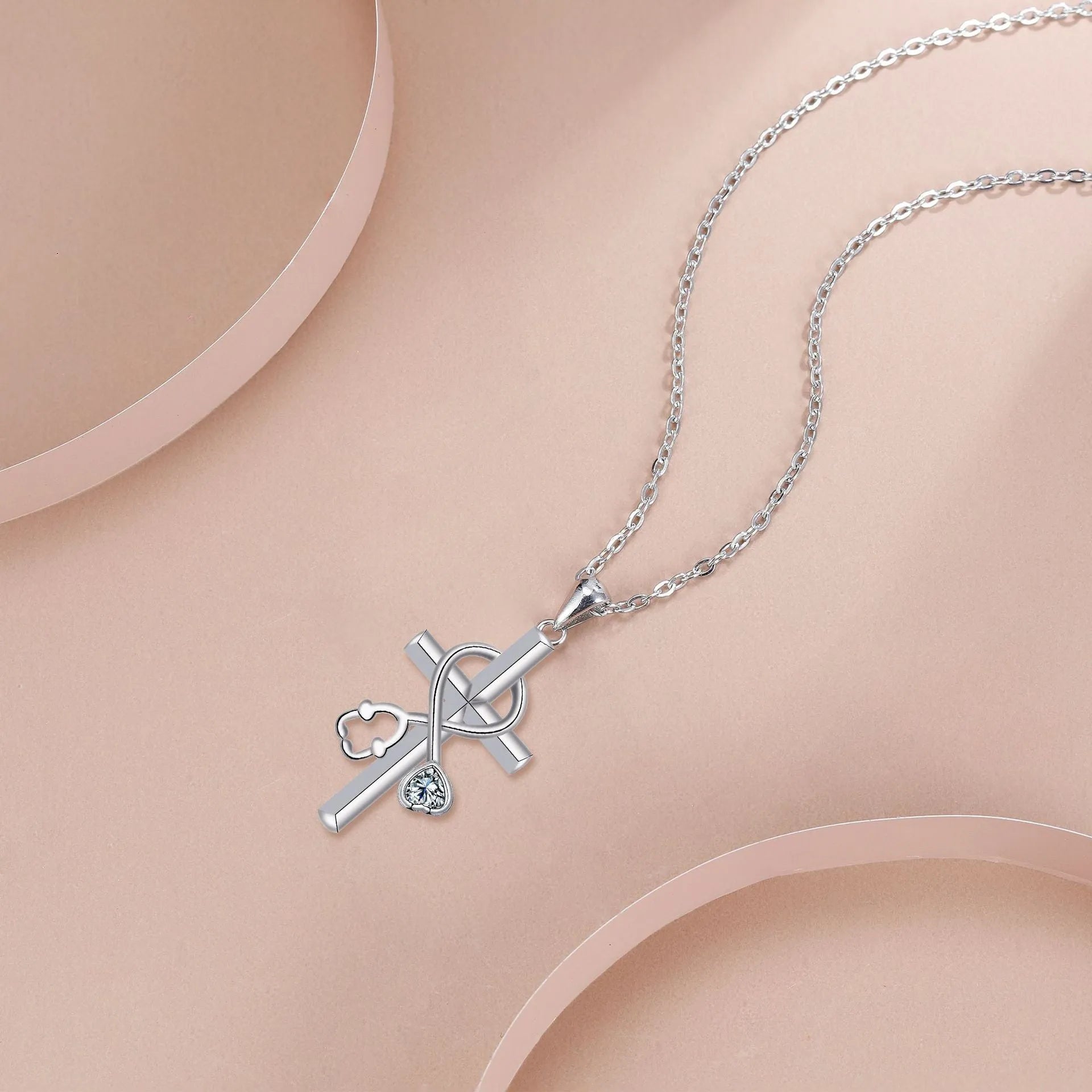 Women's stethoscope-shaped necklace with electroplated copper pendant and cross chain