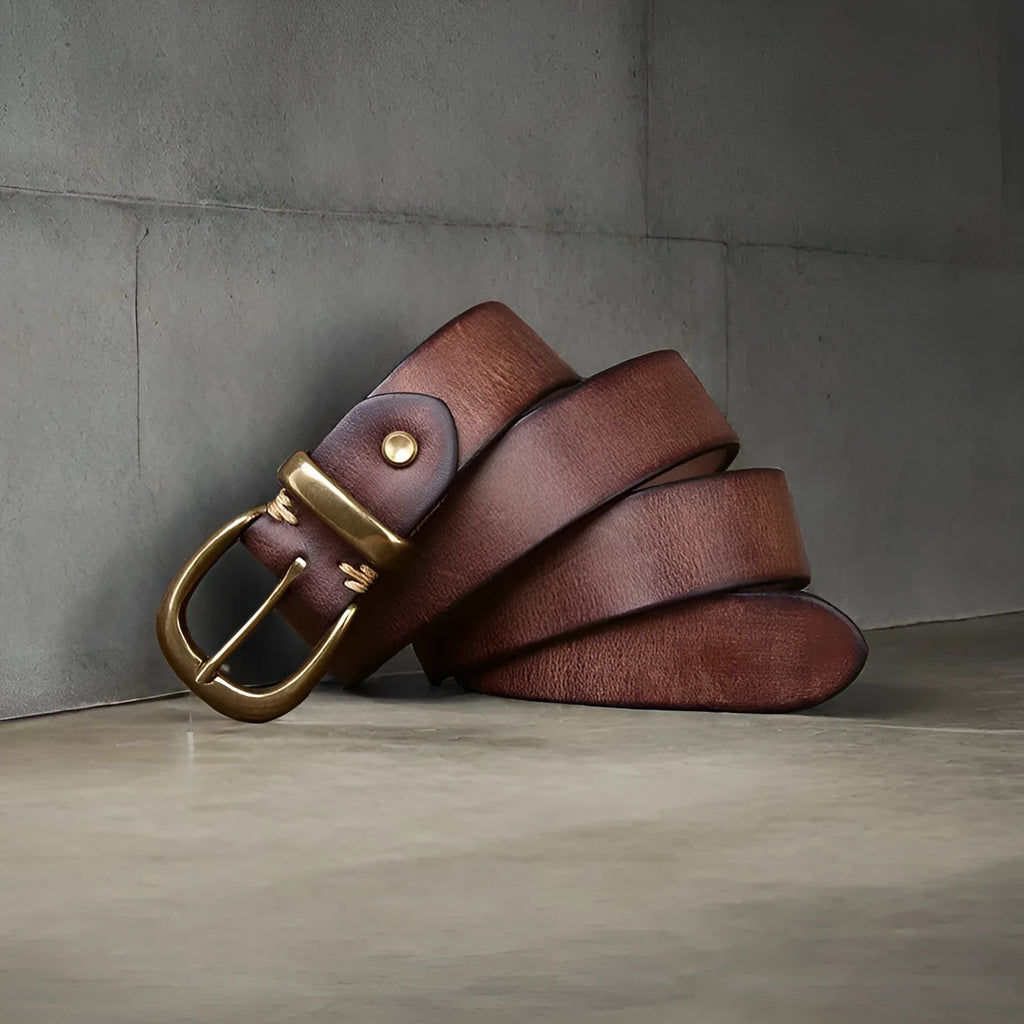 Men's black cattlehide leather casual belt with a copper pin buckle on a white background.