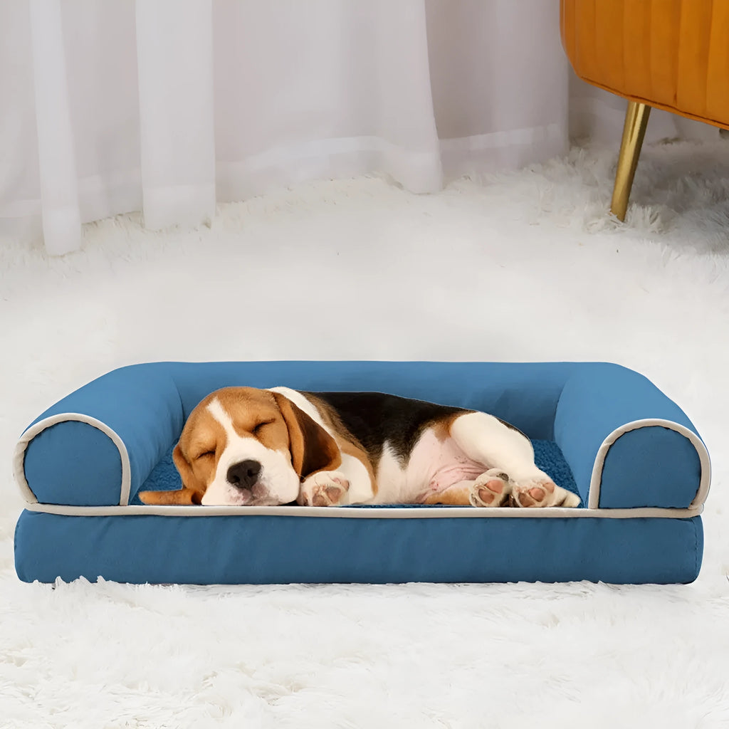 Square sponge cooling dog bed for dogs in a neutral colour on a floor.