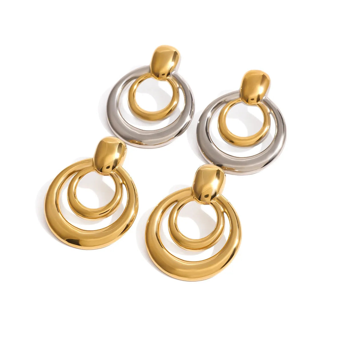 A pair of round gold-coloured geometric stud earrings with a double-layer hollow design.
