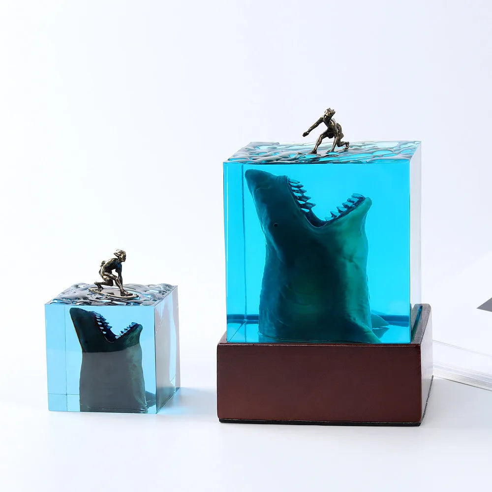 Epoxy resin shark surfer night light ornament on a desk with glowing micro landscape.