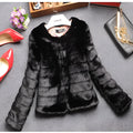 Women's short faux fur top in beige on a hanger, showing regular sleeves and textured fabric.