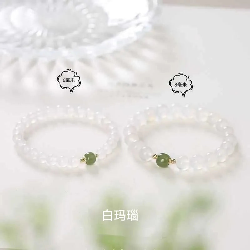 Handmade white agate and hetian jade bracelet with red cinnabar inlay forming text, shown in 6mm and 8mm bead sizes.