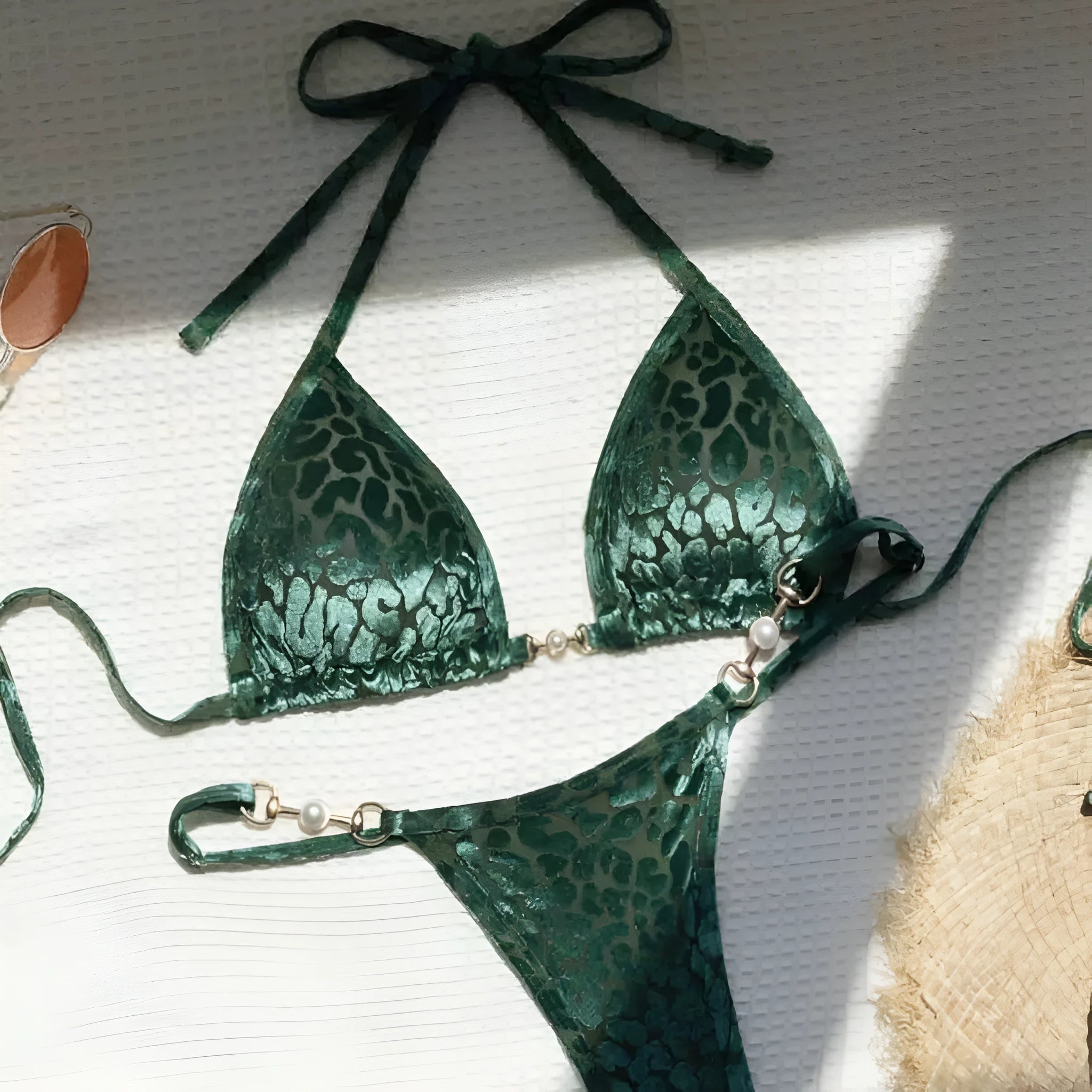 Blue leopard print T-shaped women's bikini swimsuit set on a mannequin.