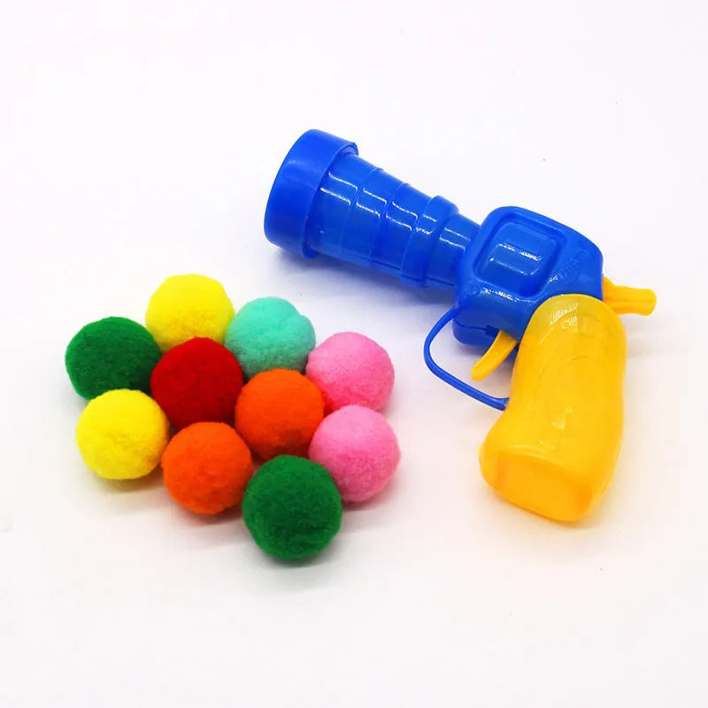 Interactive pet toy gun with plush yarn balls for dogs and cats indoor play
