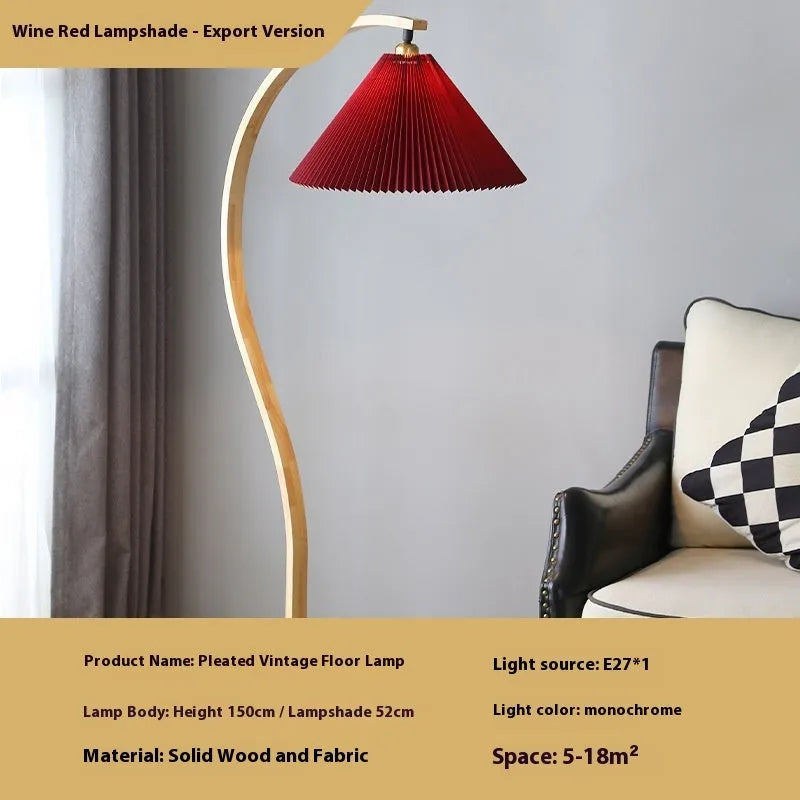 Vertical retro floor lamp with wood shade in three-colour variable light beside bed
