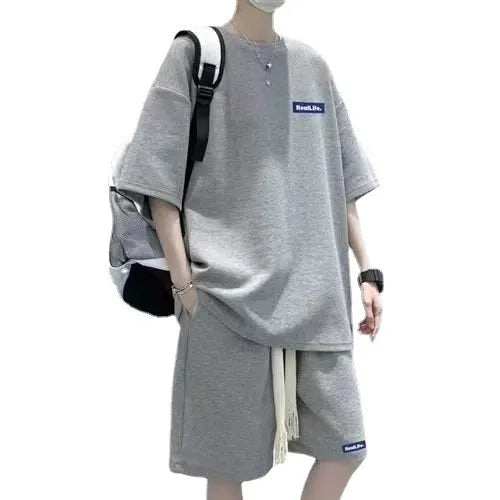 Cotton-blend waffle textured leisure sports suit with short sleeves and shorts.