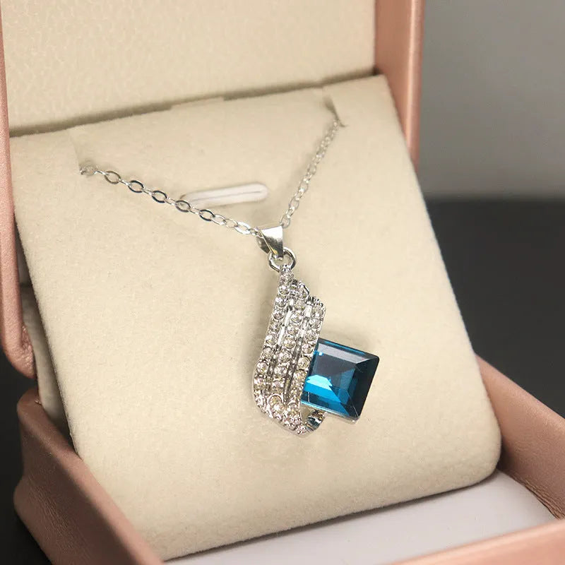 Glass and alloy necklace and earring set with cross chain styling and electroplated ornament details
