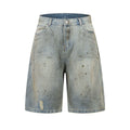 A pair of washed blue, cropped, straight-leg denim trousers on a plain background.