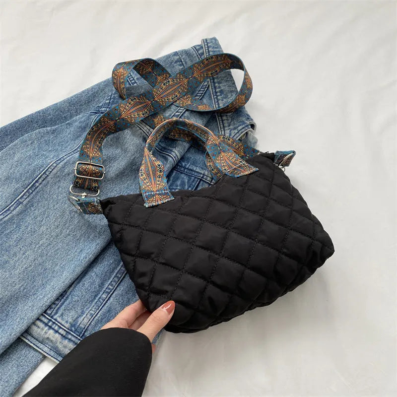 A soft Oxford cloth messenger bag in a horizontal square shape with a single shoulder strap, shown in one of five available colours.