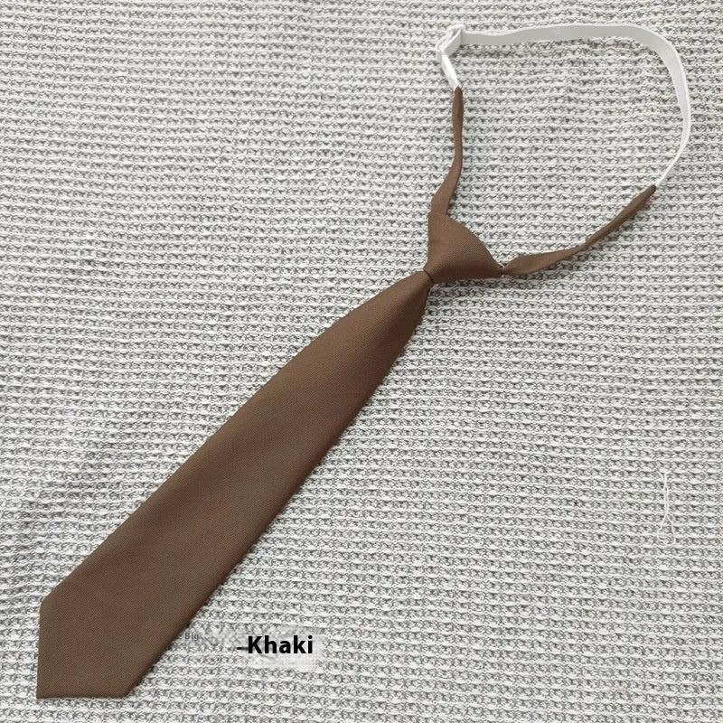Men's navy blue cotton bow tie with arrow style on a plain background.