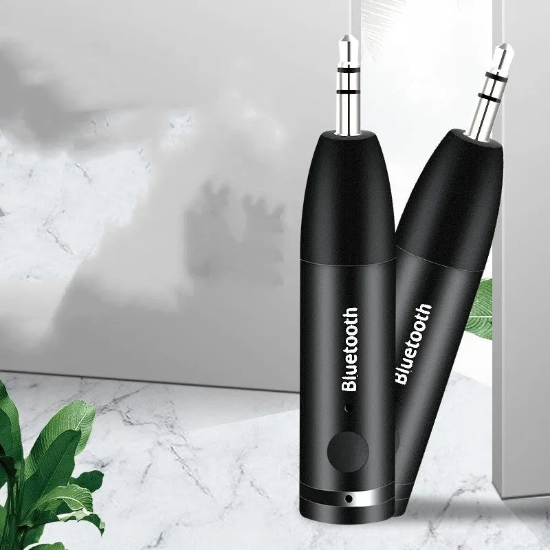 Black AUX Bluetooth 5.0 audio receiver for car stereo with USB charging cable