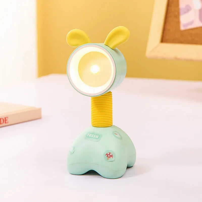 DIY cartoon animal small night lamp with magnetic base in assorted colours on a desk.