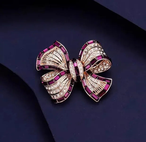 Alloy bow brooch in purplish red, blue, and purple colours for women