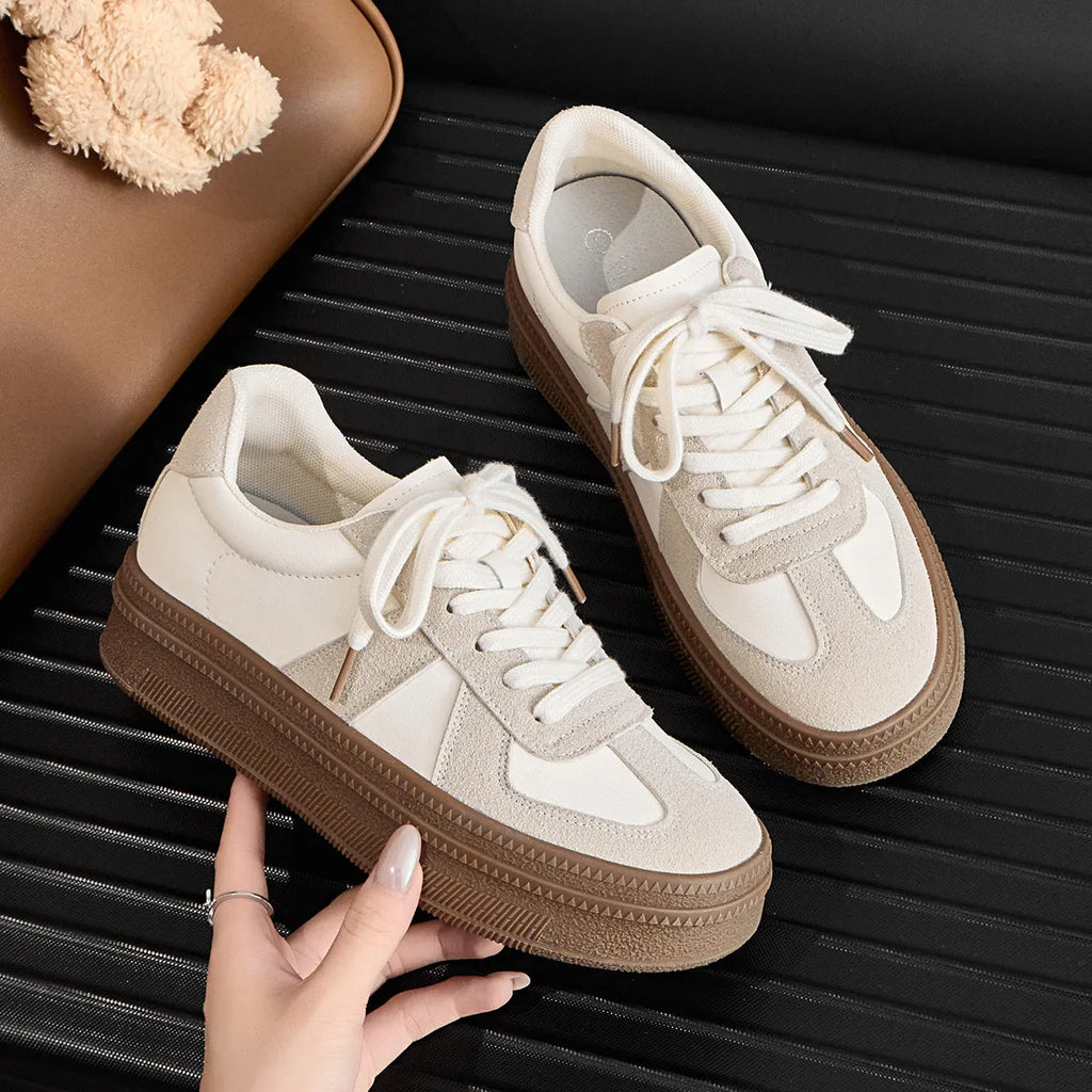 Retro round toe casual sports trainers in milky white with cross straps and lace-up front