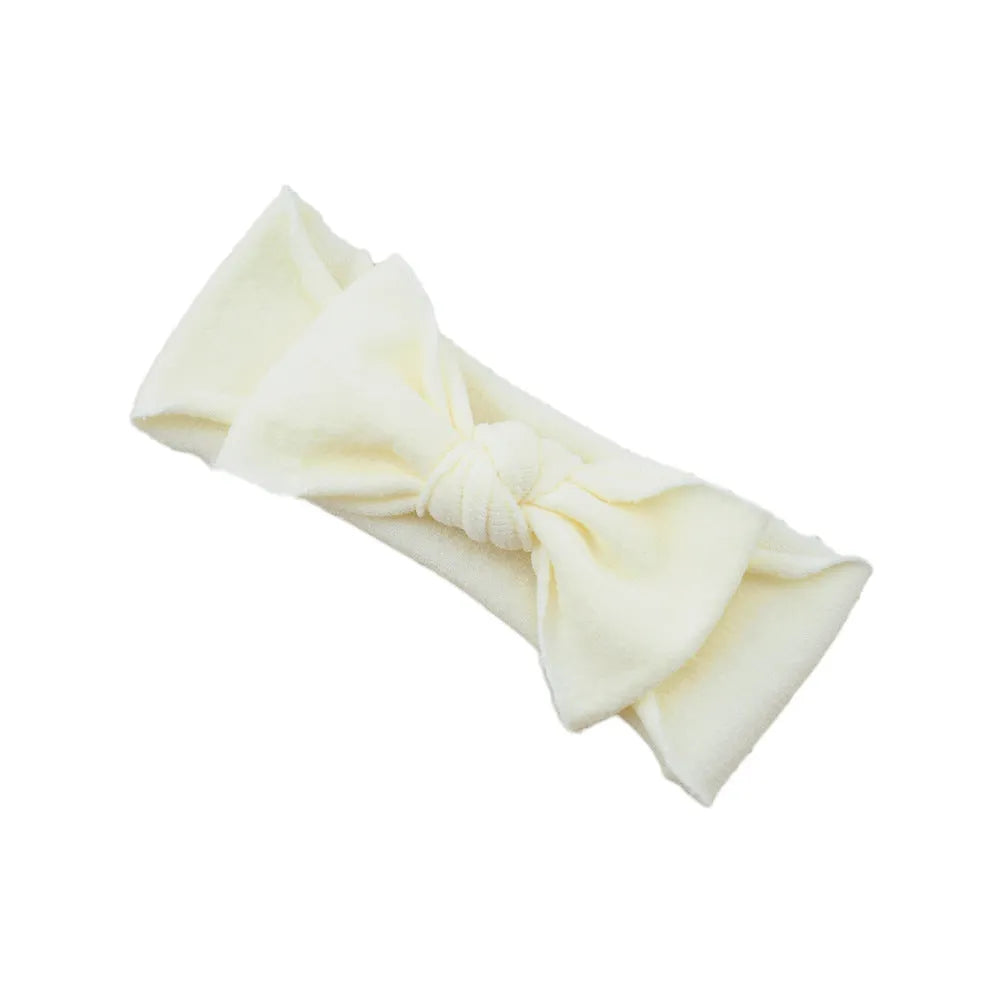 Solid colour knotted cloth headband for baby girls with bowknot design, available in 37 colours