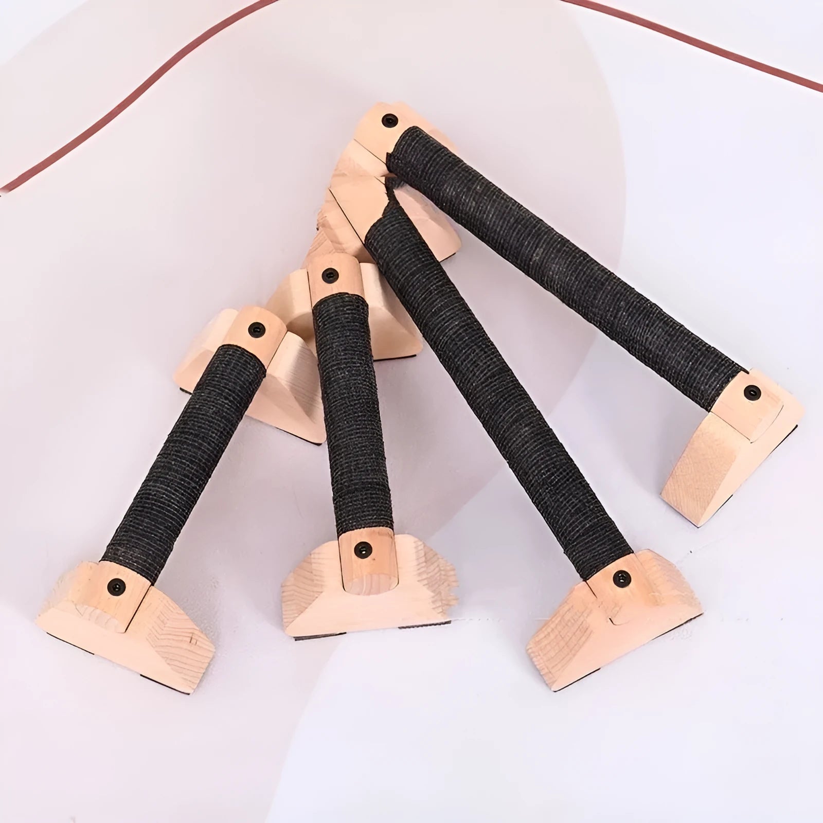 Two solid wood single parallel bars on a floor, one beech and one rubber wood, for home fitness training