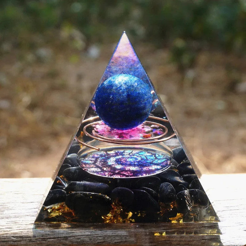 Clear resin pyramid ornament with embedded crystal gravel pieces, 6cm tall with hanging cord.
