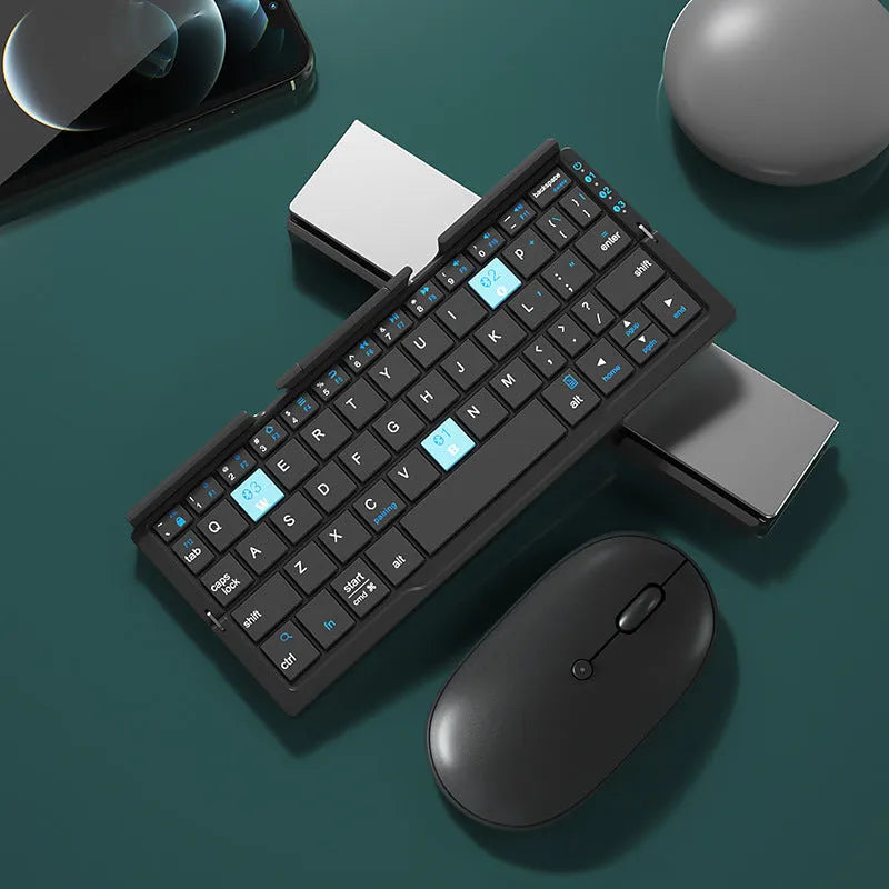 Silver aluminium folding Bluetooth keyboard open with phone on stand next to folded size comparison
