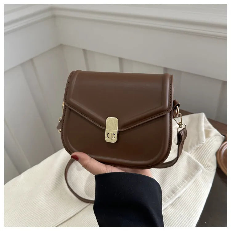 Niche texture shoulder messenger bag in soft PU leather with clamshell opening and horizontal square shape