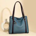 Women's soft black PU leather retro crossbody bag showing double straps and horizontal square shape.