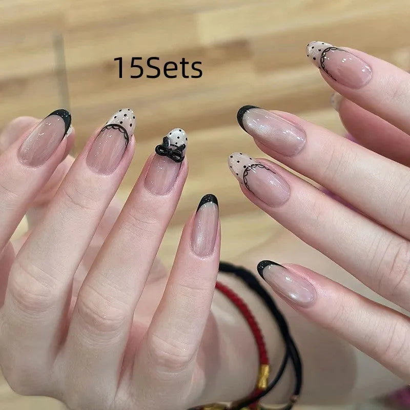 Set of colourful artificial false nails with glitter designs for DIY manicures.