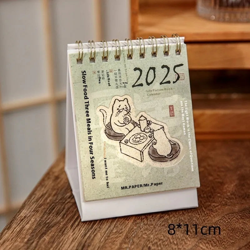 Mini 2025 desk calendar showing four design options including coffee time and motivational phrases
