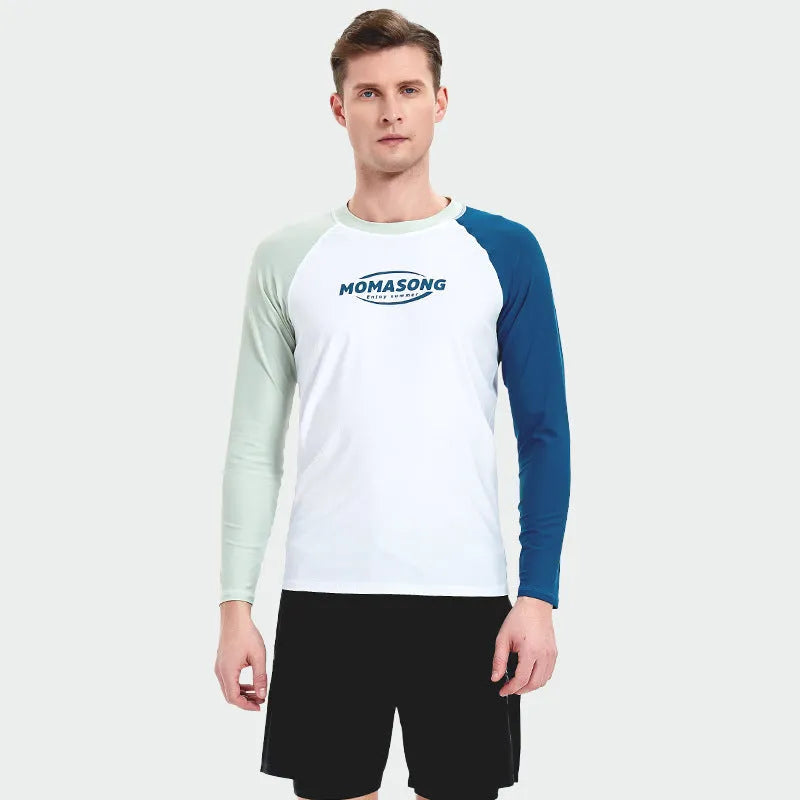 Men's white long-sleeved swim top with matching blue double-layer swim trunks on a beach.