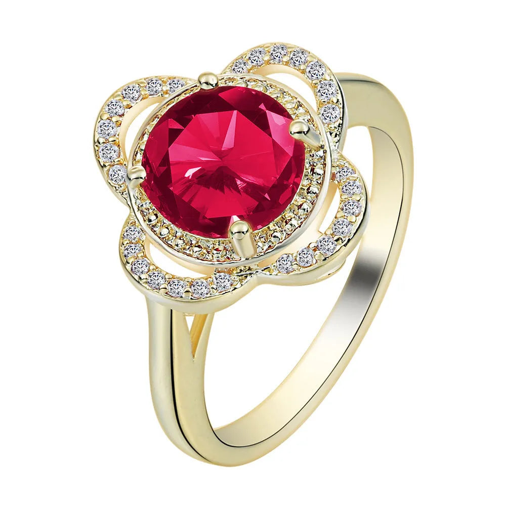 Copper ring with a zircon stone inlay in a fruit shape design on a finger.