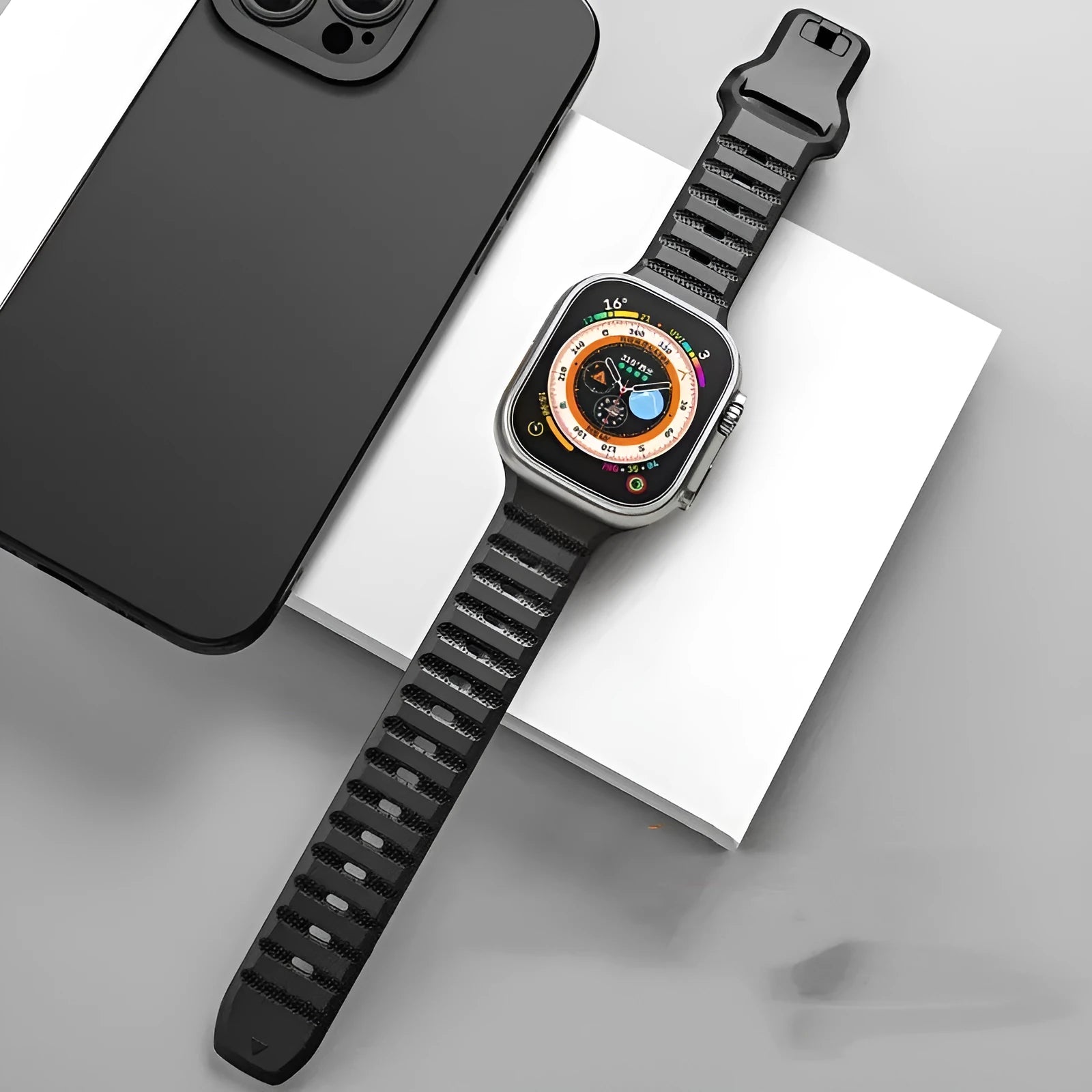 Fluoro rubber Apple Watch band in multiple colours on a grey background showing the T buckle clasp.
