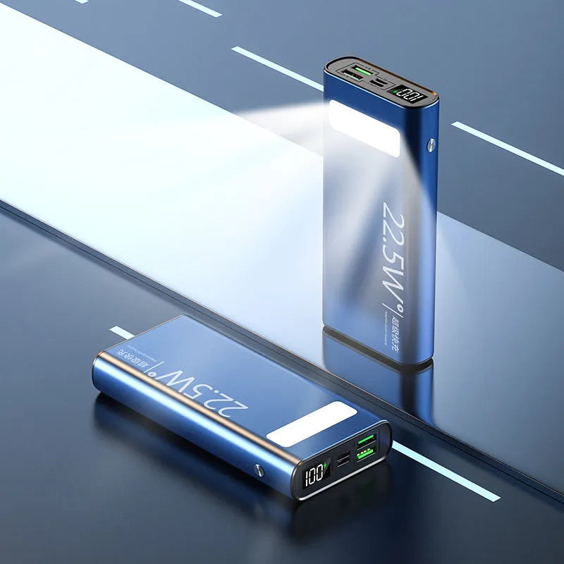 Black alloy power bank with LCD screen showing battery level, alongside green, red, and blue colour options.