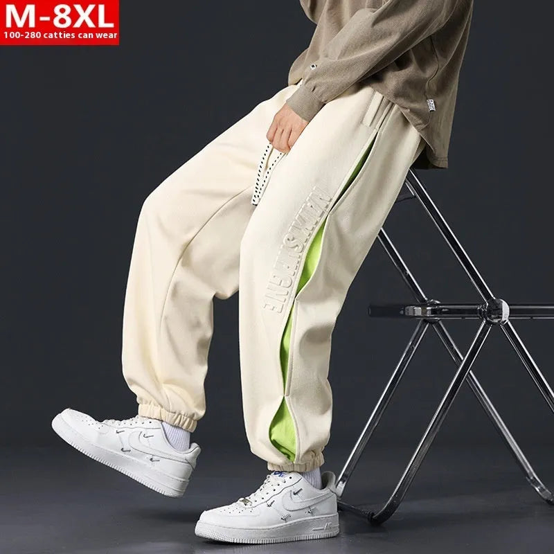Men's loose fit cotton casual trousers with stitching print design and banded ankle cuffs.