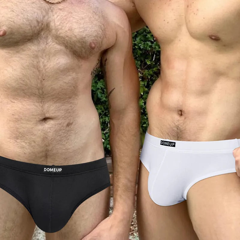 Men's solid colour low-waist seamless briefs in white, black, and pink on a size chart.