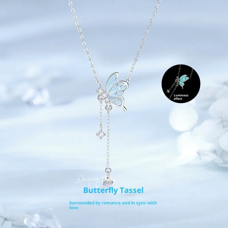 Sterling silver S925 butterfly tassel necklace with noctilucent luminous pendant and adjustable O-ring chain on white background