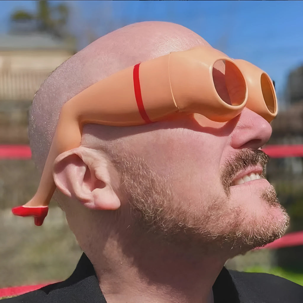 Orange Novel Personality Leg Hip Sunglasses, a plastic fashion accessory for sun protection and parties.