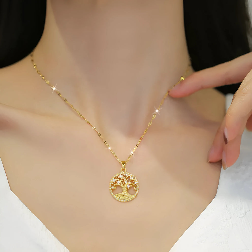 Gold-plated adjustable necklace with cross pendant showing mother of pearl inlay and rhinestone lucky tree design