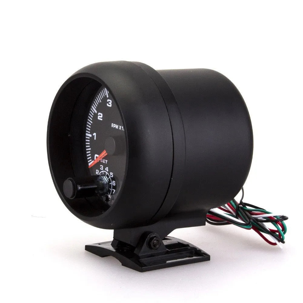 Black automotive tachometer with blue light pointer on a 0-8000 RPM scale
