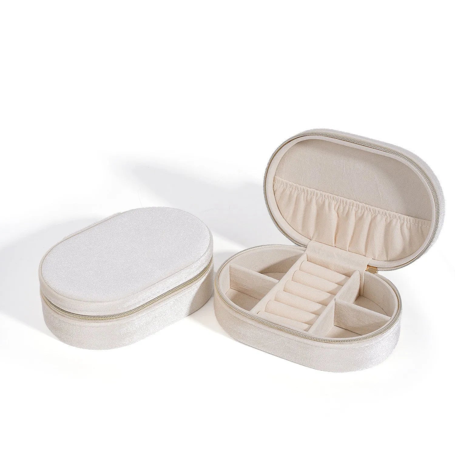 Oval shaped velvet jewellery storage box in multiple colours with flannel interior, measuring 15 by 10 by 5 cm.