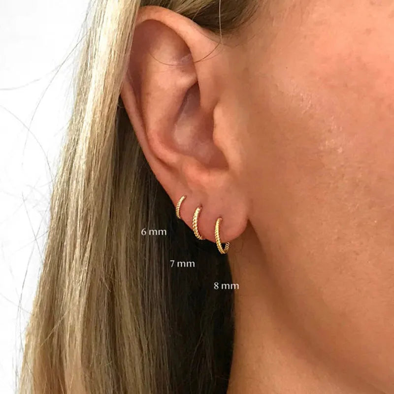 Sterling silver twisted ring earrings in geometric round design with gold or white gold finish