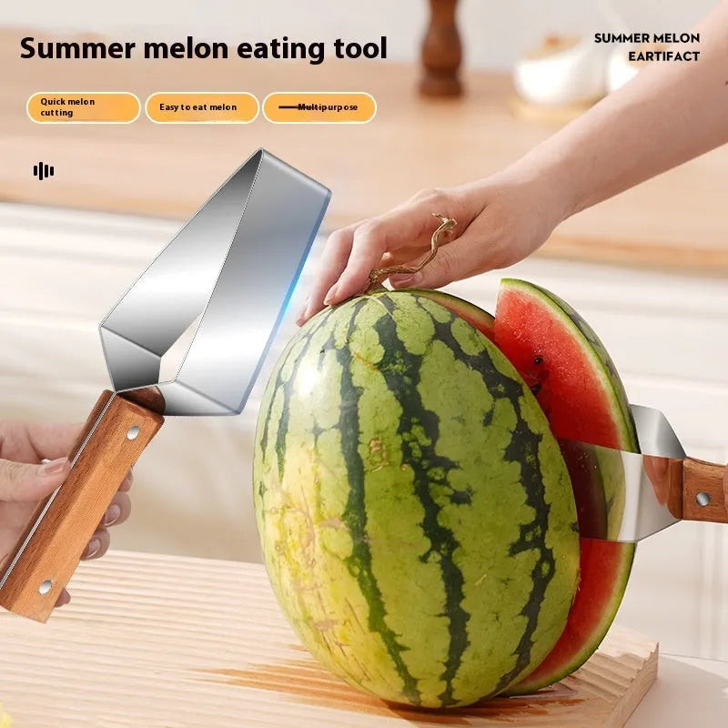Stainless steel watermelon splitter with triangle cutting piece and protective cover on a kitchen counter.