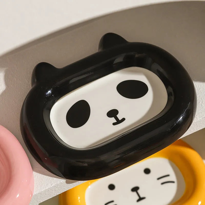 Ceramic pet bowl with an animal design, shown on a table.