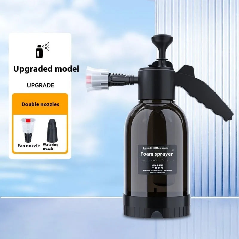 Black hand-held 2-litre multi-purpose sprayer with ergonomic handle and two nozzles