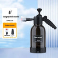 Black hand-held 2-litre multi-purpose sprayer with ergonomic handle and two nozzles